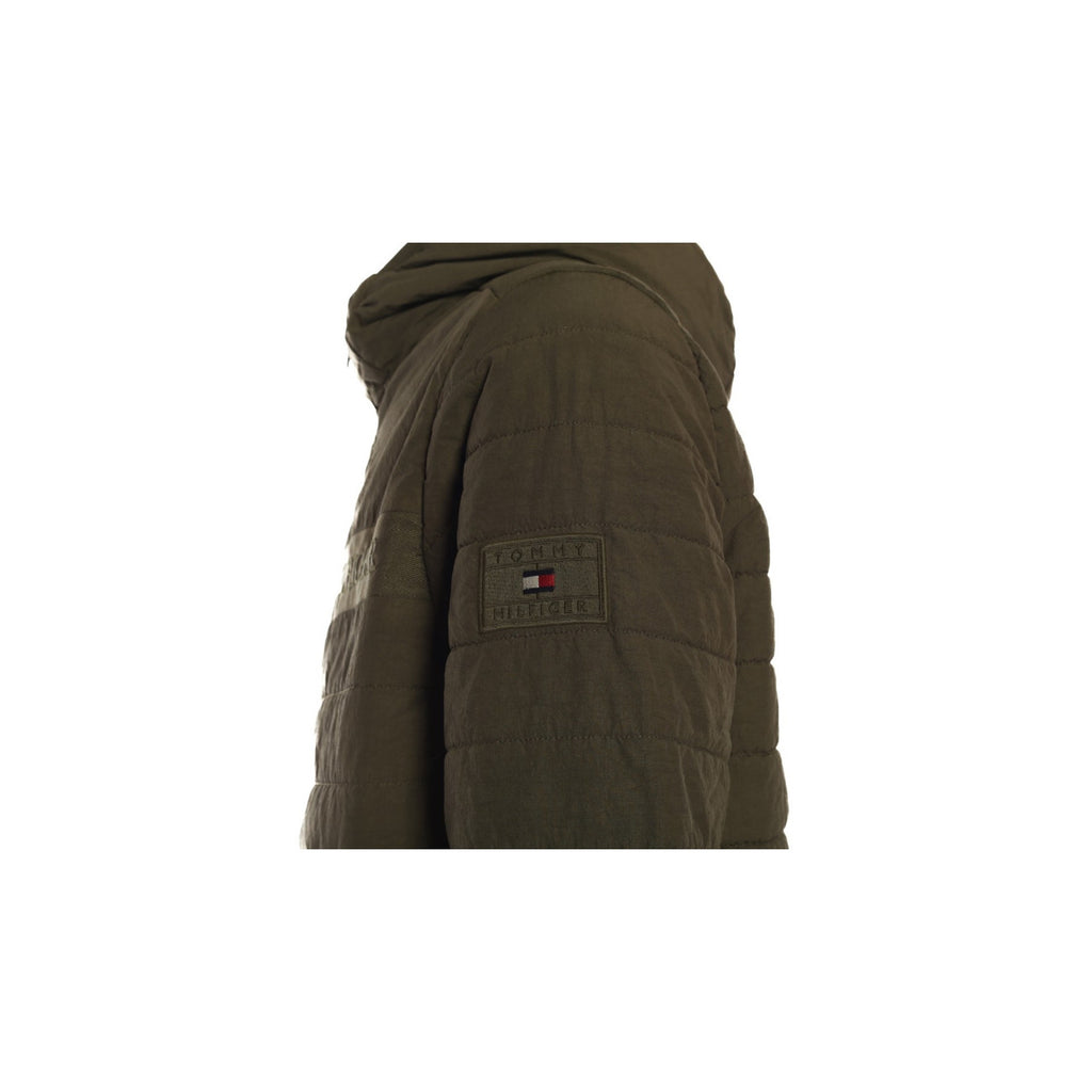 Side view of the brown jacket highlighting the textured fabric and hood on a white background