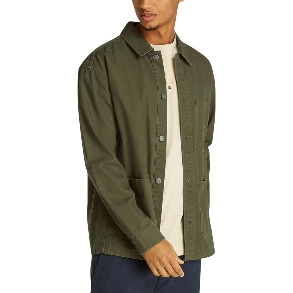 Front view of a green blazer with button closure and long sleeves displayed on a white background.