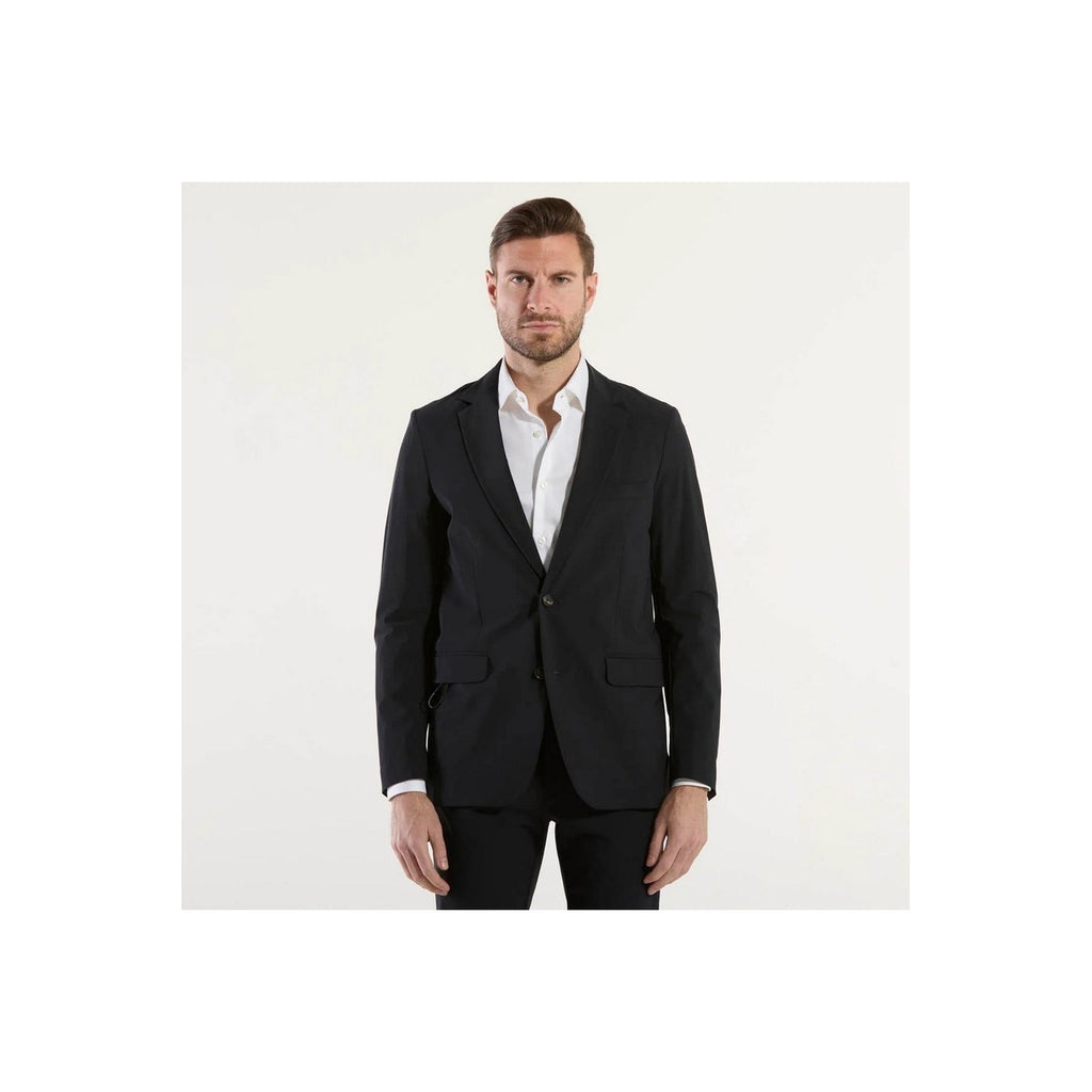 Front view of a man in a tailored black suit with a white shirt on a white background