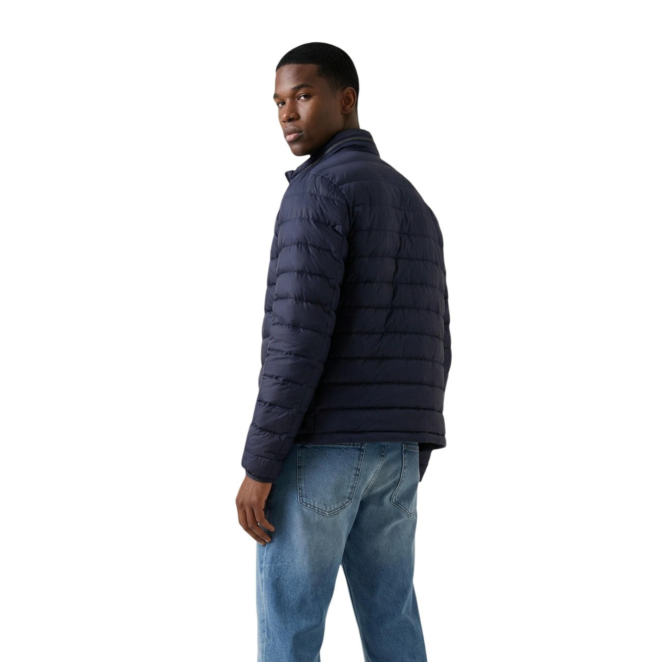 Side view of the navy puffer jacket highlighting the zipper closure and quilted design on a white background