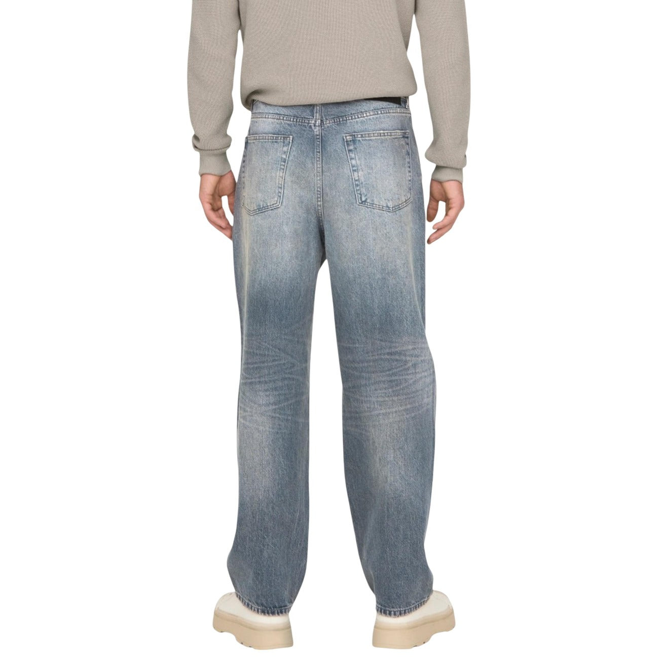 Back view of a man in light blue faded denim jeans showing pockets, on a white background.