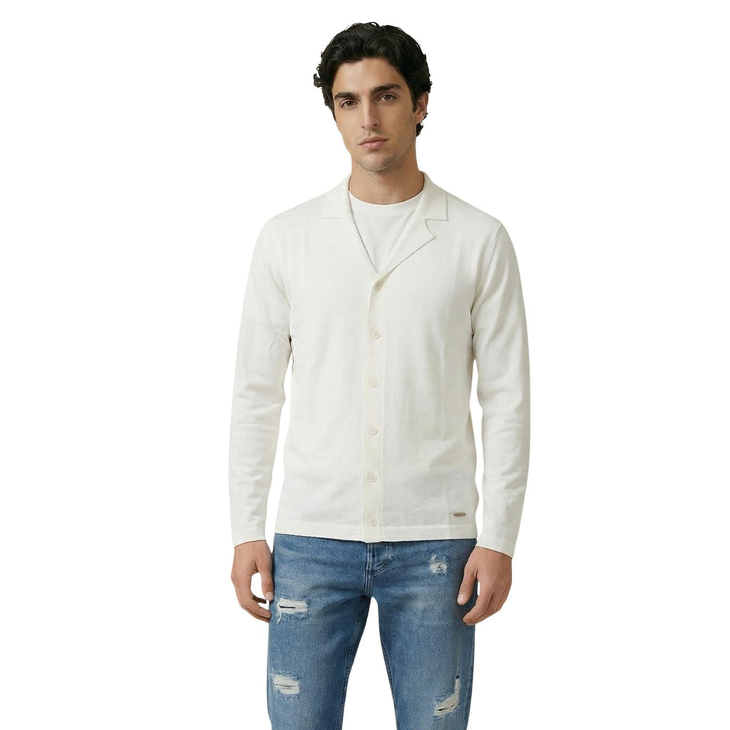 Lifestyle shot of a man in a white cardigan with long sleeves against a white background.