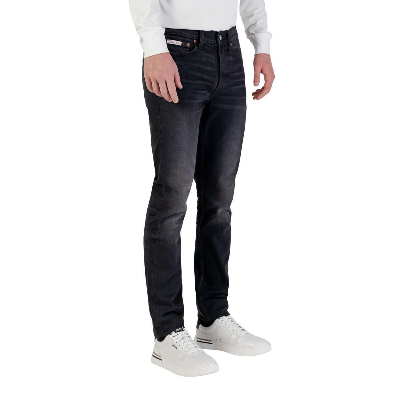Side view of the black slim fit jeans featuring five pockets on a white background