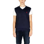 Front view of the navy sleeveless gilet featuring a v-neck and logo detail on a white background.