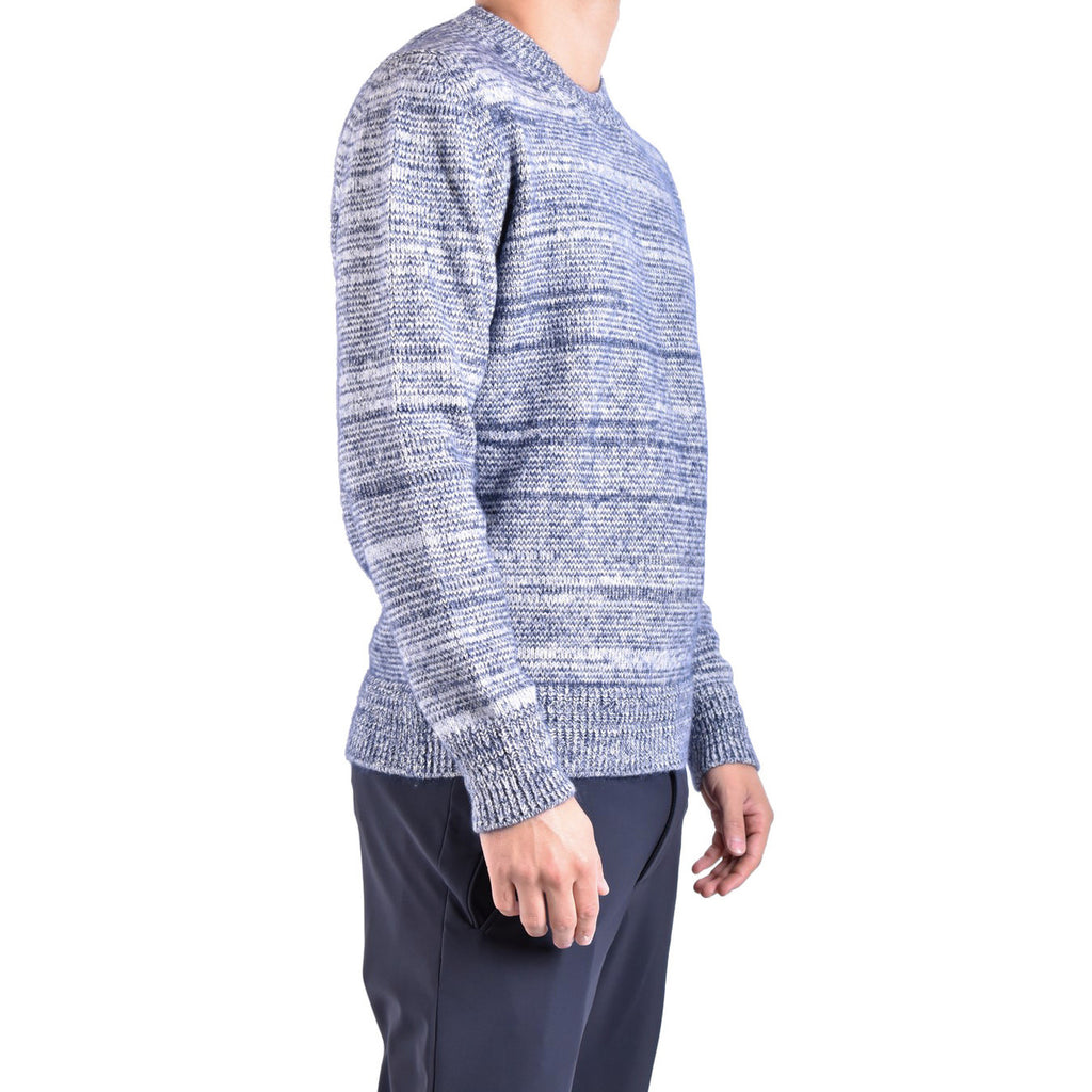 Side view of the blue striped sweater showcasing long sleeves and a v-neck in a studio background.