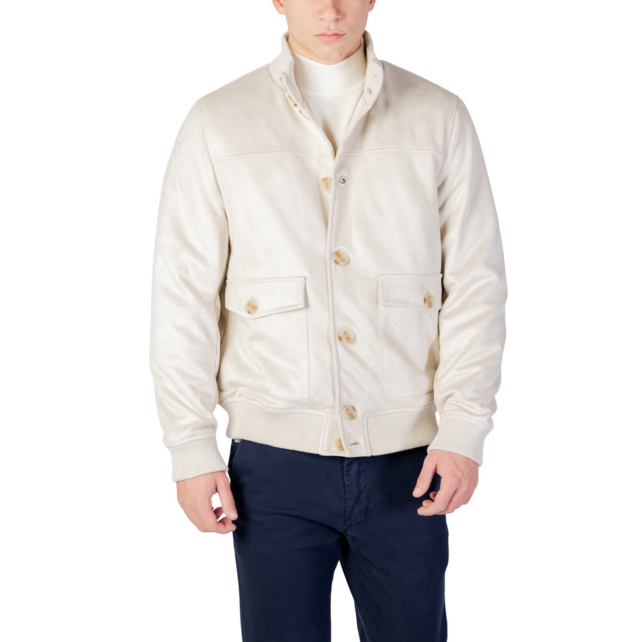 Front view of the light beige blazer featuring button closure and quilted design.
