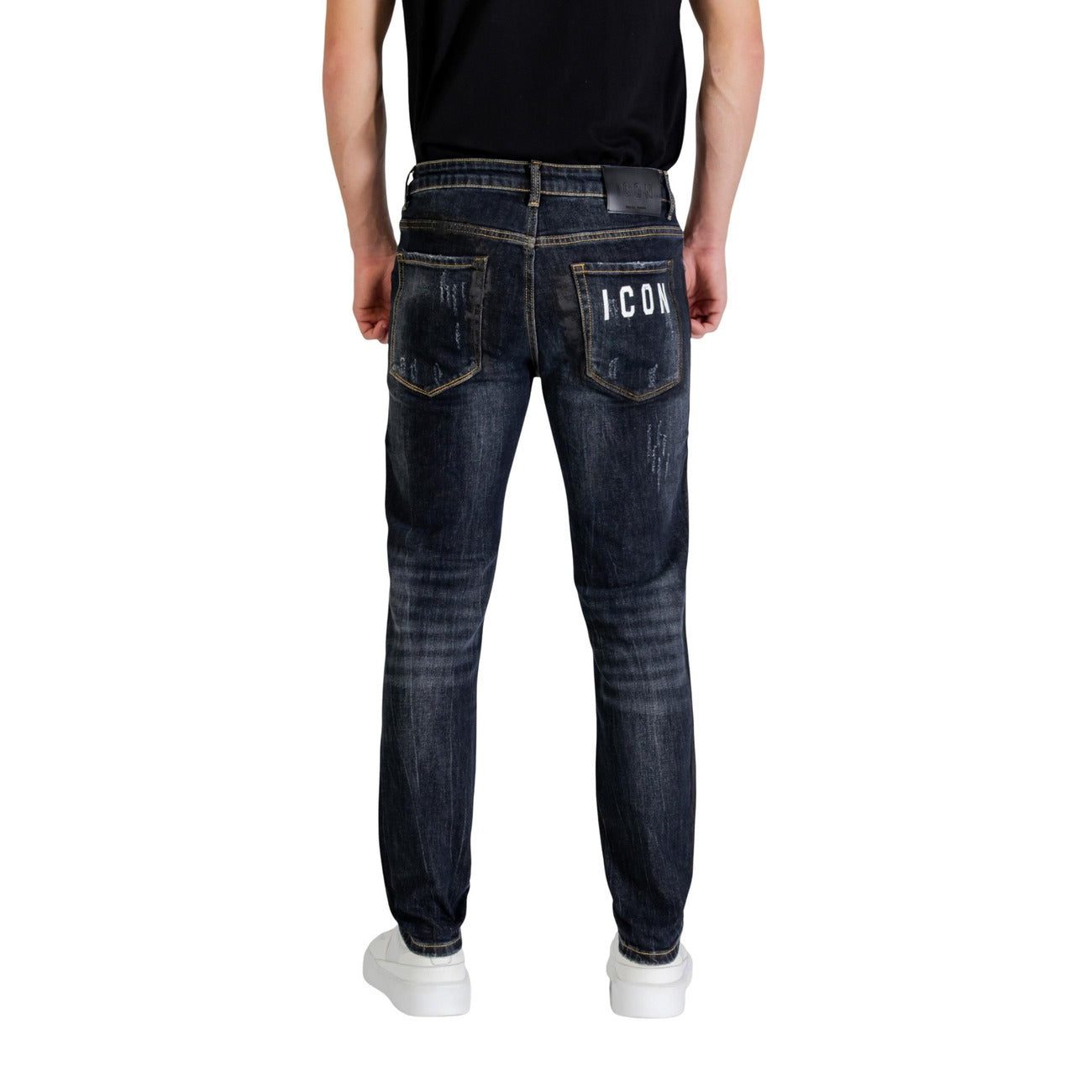 Back view of the blue distressed jeans showcasing pockets and ripped details on a white background.