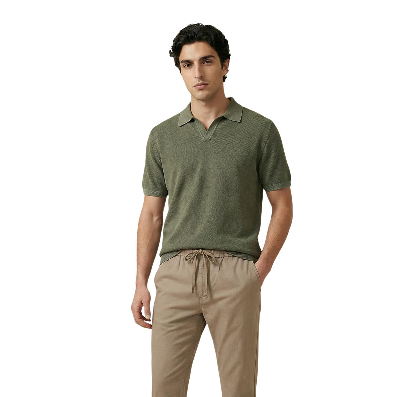 Lifestyle shot of a man in a green polo shirt with short sleeves and collar against a white background.