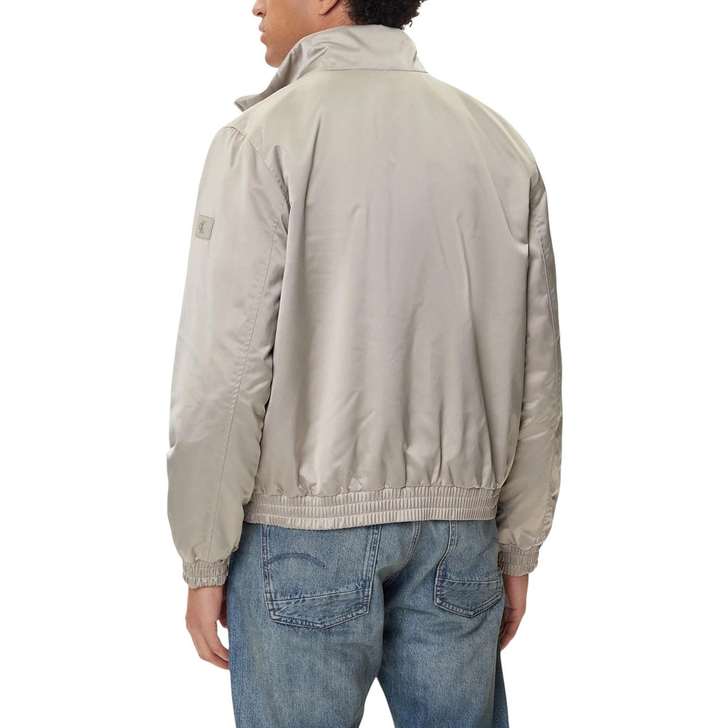 Back view of the grey blazer showcasing the collar and elastic waistband.