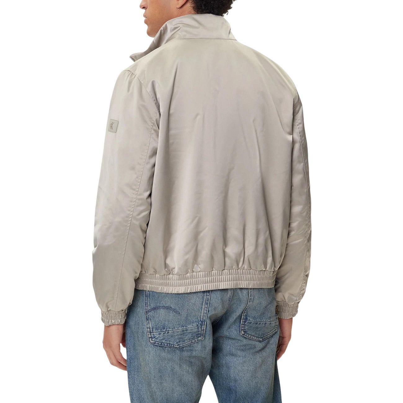 Back view of the grey blazer showcasing the collar and elastic waistband.