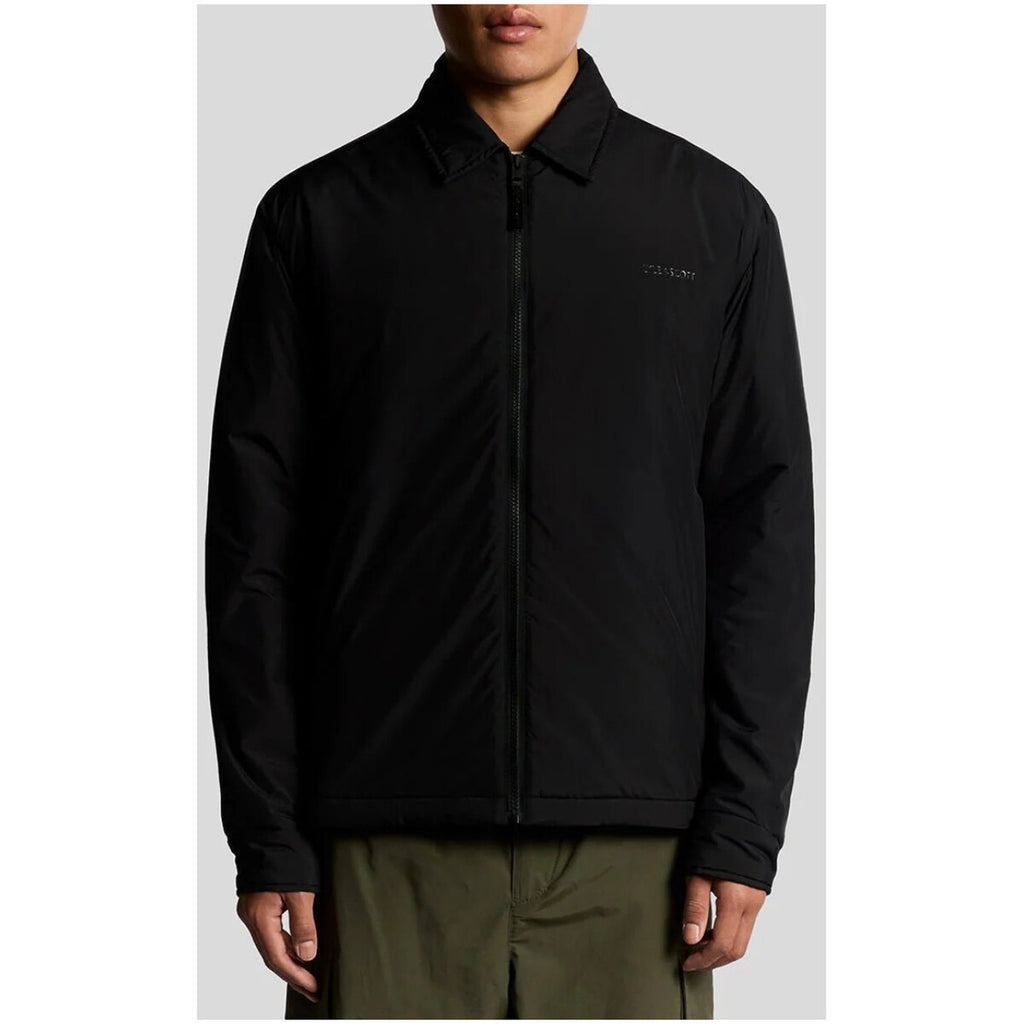 Front view of the black blazer featuring a zipper closure and collar.