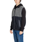 Side view of the black hooded jacket with a zipper closure and two-tone design.