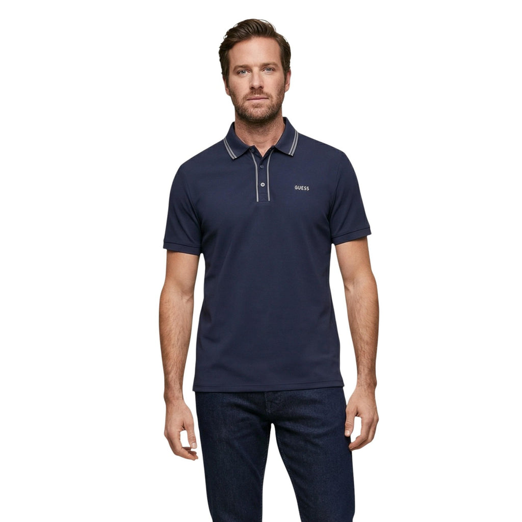 Front view of the navy polo shirt with short sleeves and logo on chest against a white background.