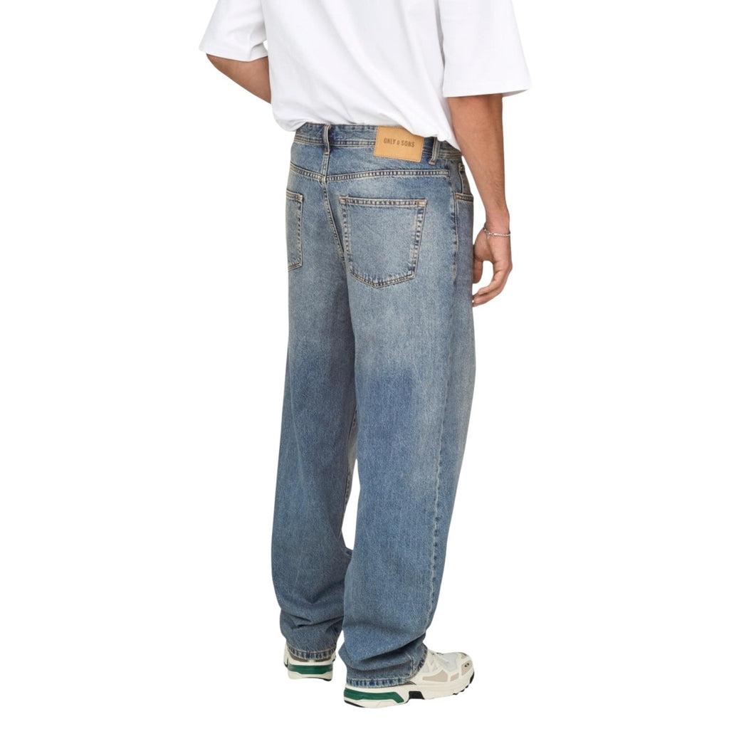 Back view of the blue jeans showcasing back pockets and belt loops against a white background