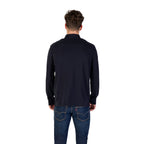 Back view of the navy long-sleeve polo shirt showcasing the collar on a white background.