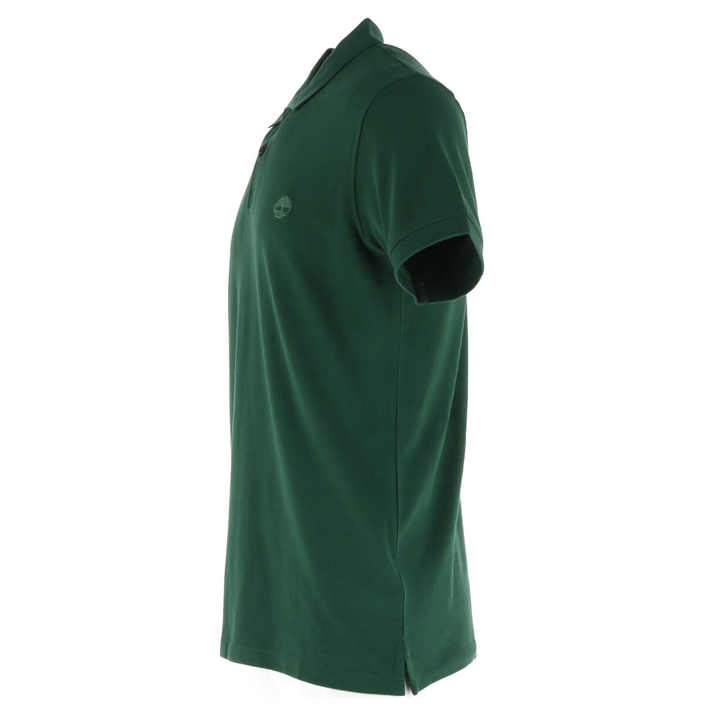 Side view of the green polo shirt with a collar and short sleeves on a white background.