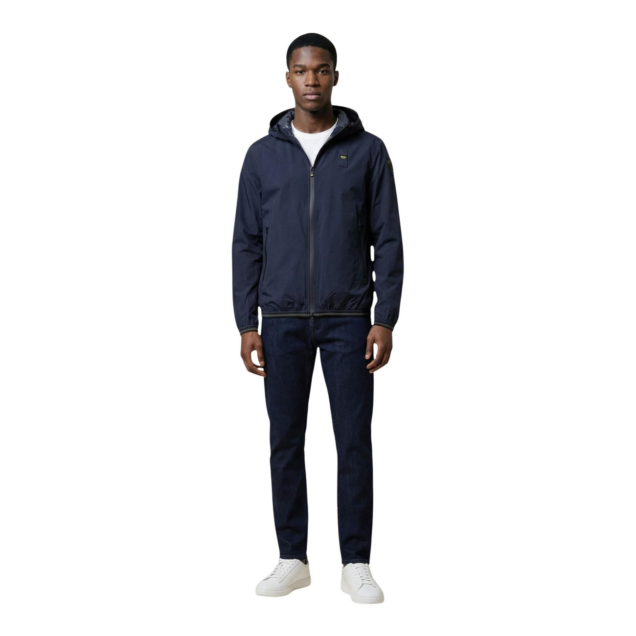 Lifestyle shot of the blue blazer paired with casual pants, highlighting the hoodie feature.