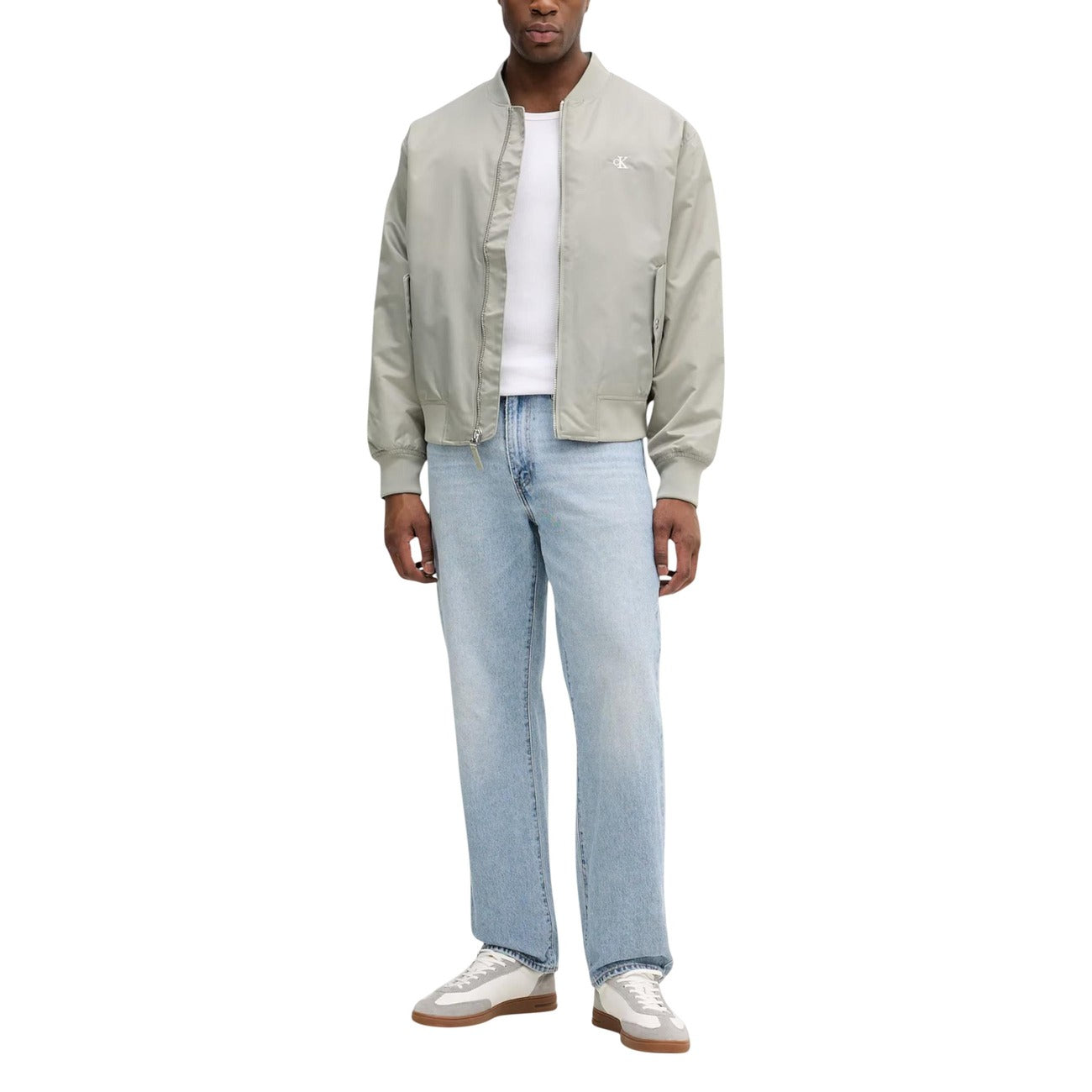Lifestyle shot of the green blazer featuring a casual fit against a white background