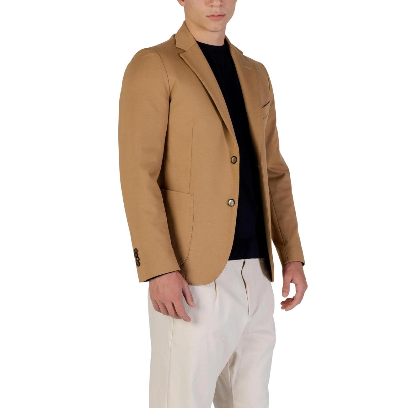 Side view of the beige tan blazer highlighting a slim fit and shoulder padding.