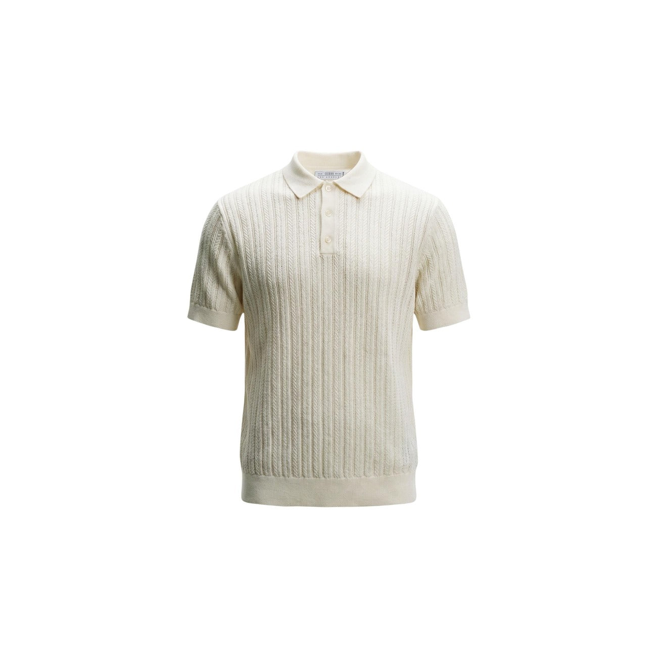 Lifestyle shot of a man in a white polo shirt featuring short sleeves and a collar.