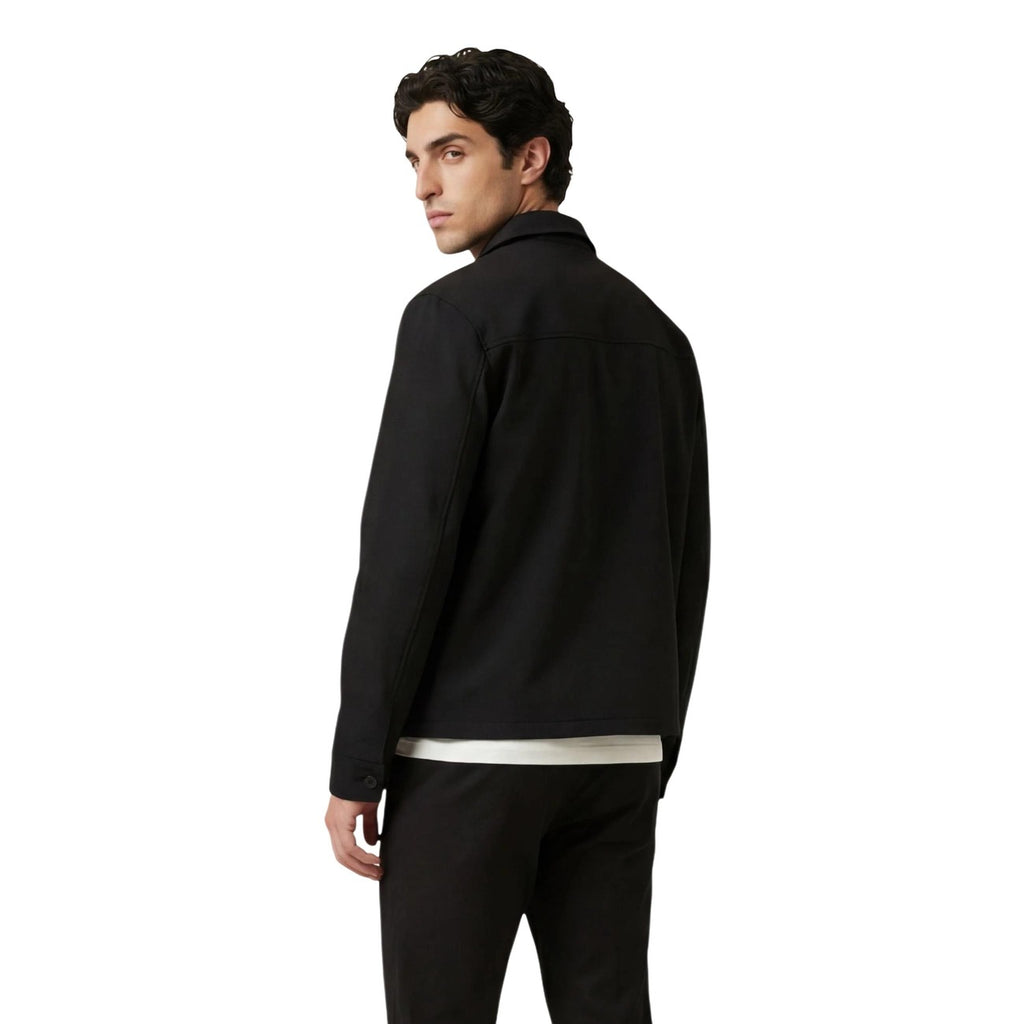 Back view of the black blazer showcasing the collar and front pockets.