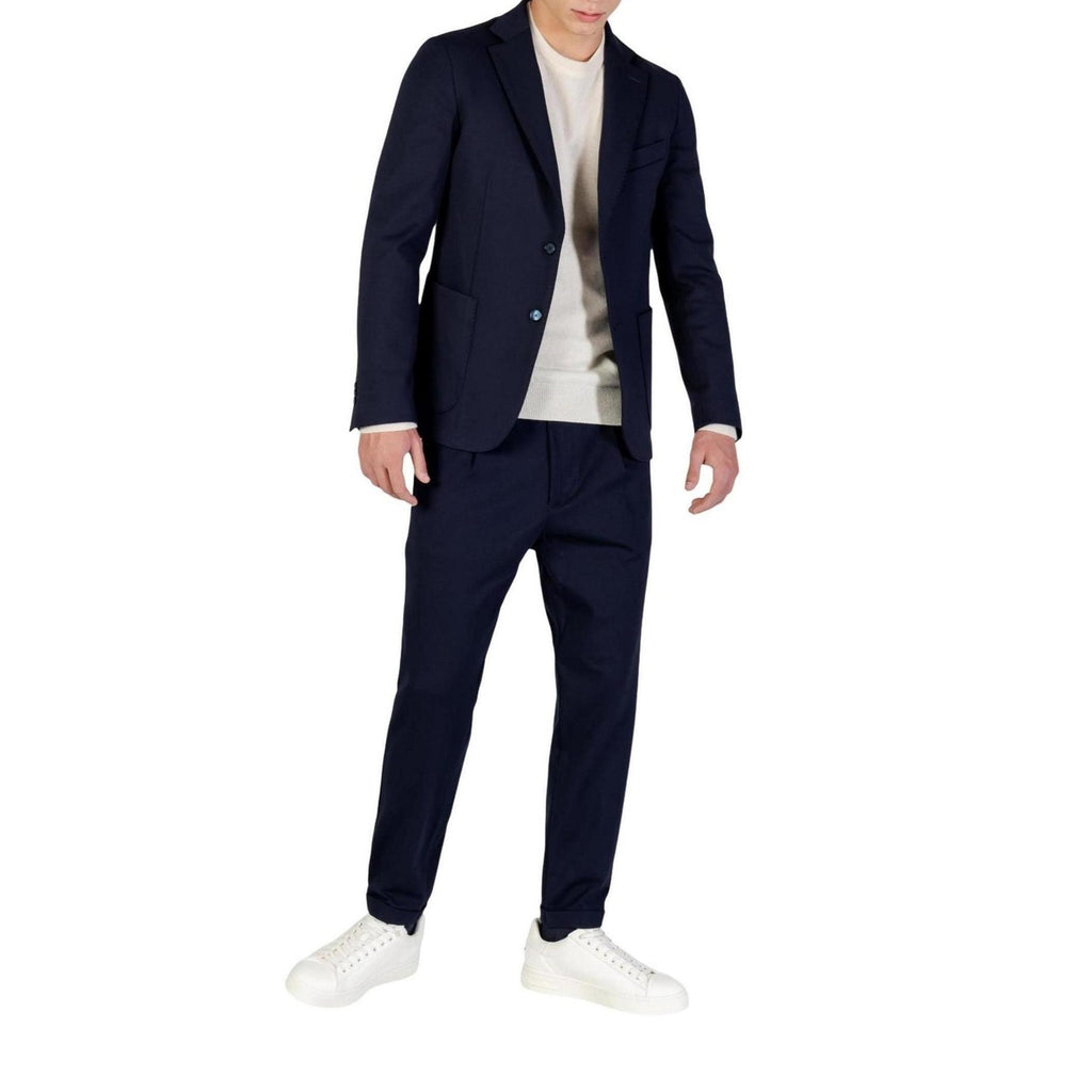 Back view of a navy suit featuring structured shoulders on a white background