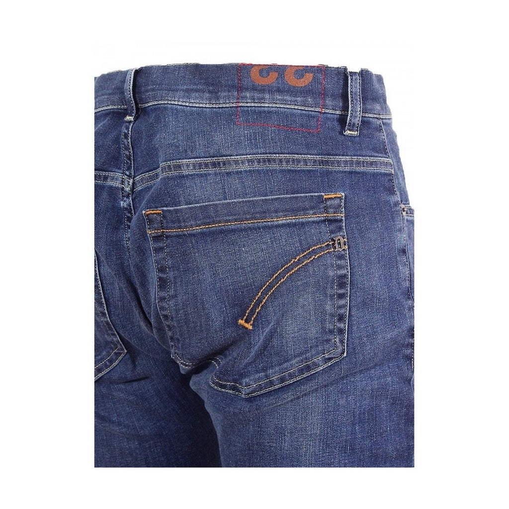 Detail close-up of blue jeans showcasing stitching details and pockets on a white background
