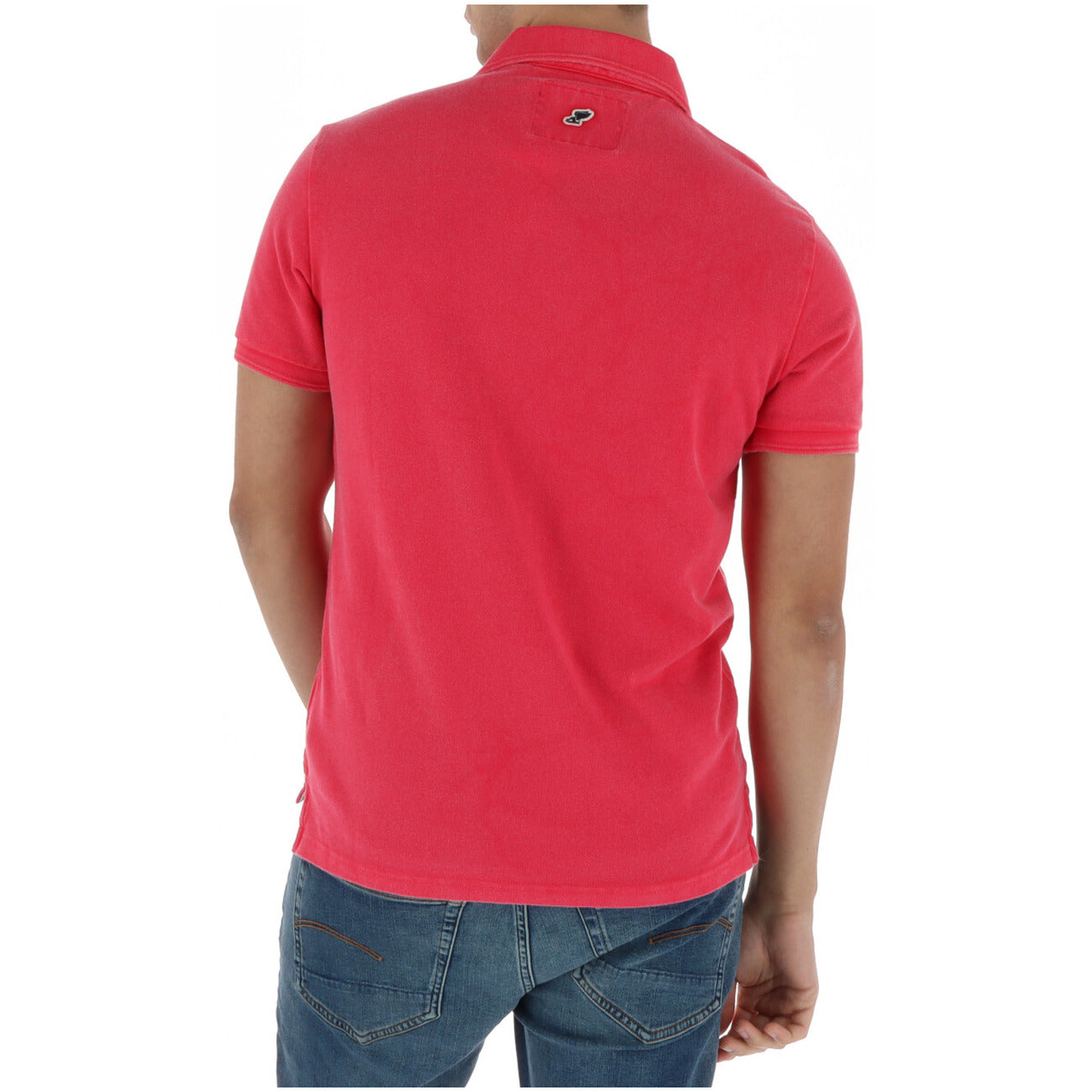 Lifestyle shot of the fuchsia polo shirt featuring short sleeves and collar on a white background