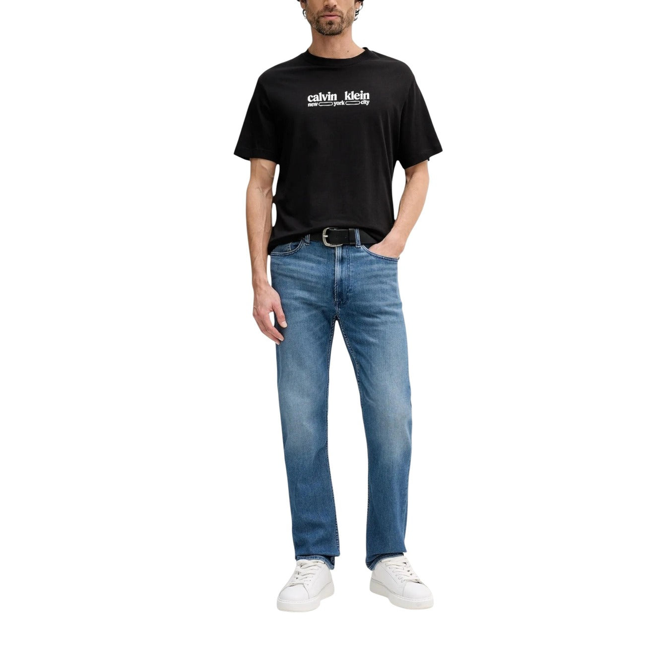 Back view of blue jeans highlighting back pocket detail on a white background
