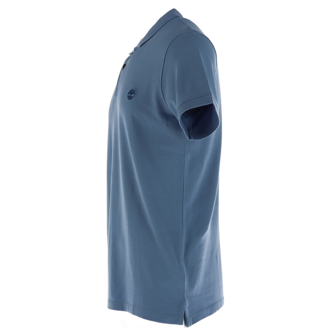 Side view of the light blue polo shirt with a collar and short sleeves displayed on a white background.