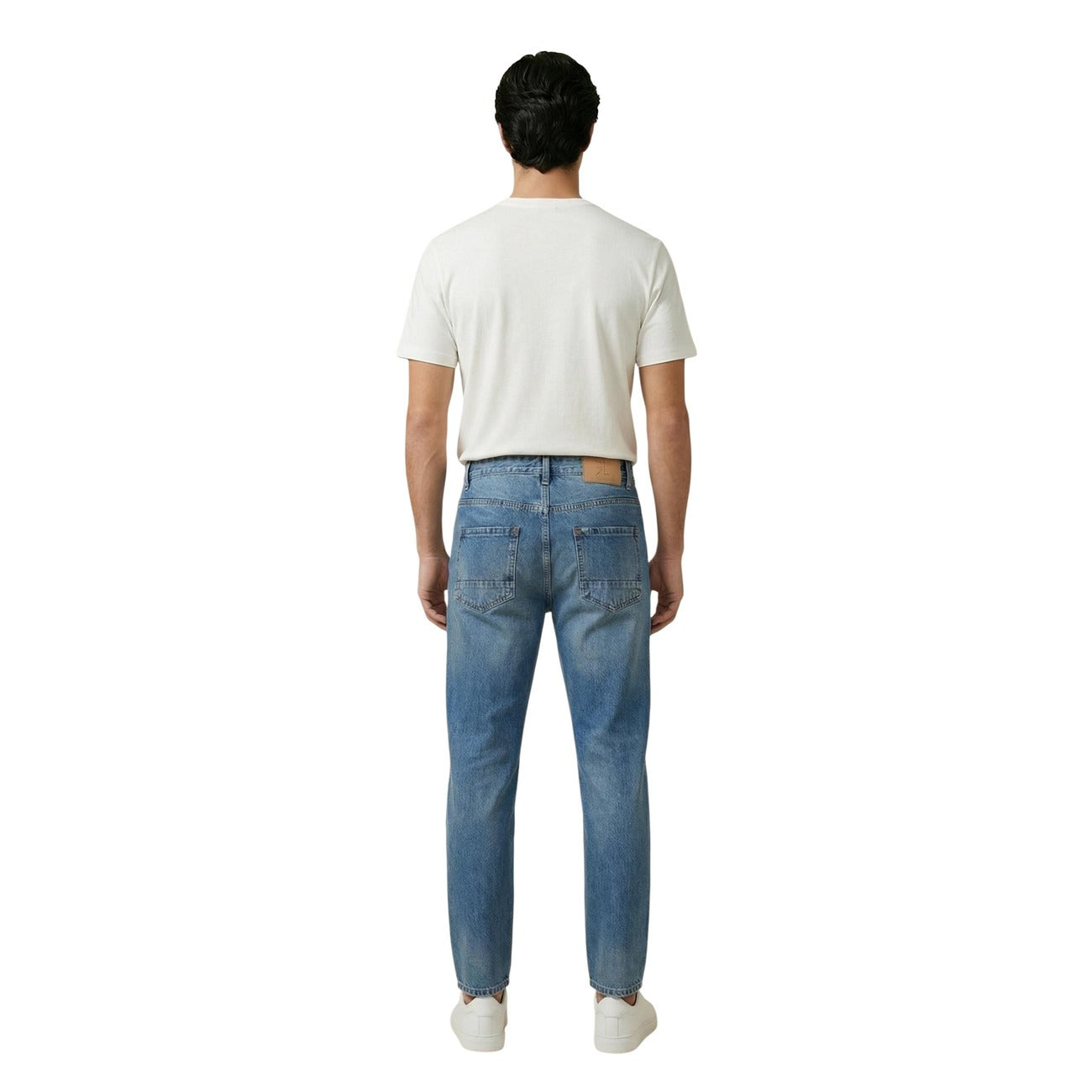 Back view of distressed light blue jeans showcasing details on a white background