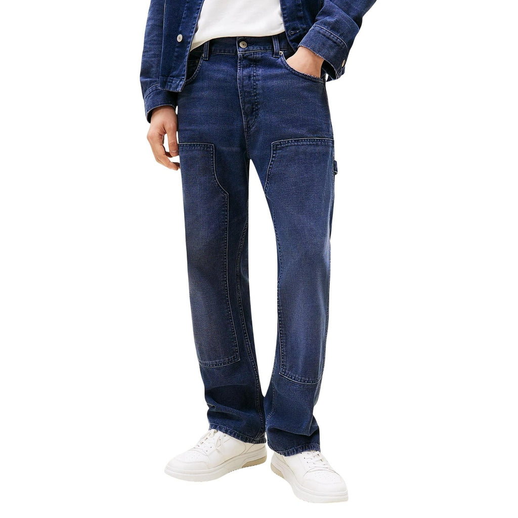 Front view of blue jeans featuring a straight fit and five pockets on a white background.