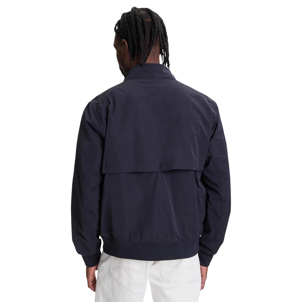 Back view of the navy blazer showcasing collar and pockets on a white background